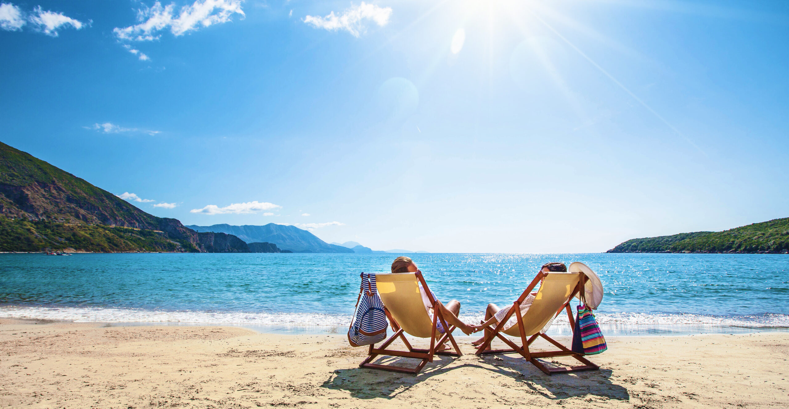 Happy couple relaxing on the beach. Summer vacation