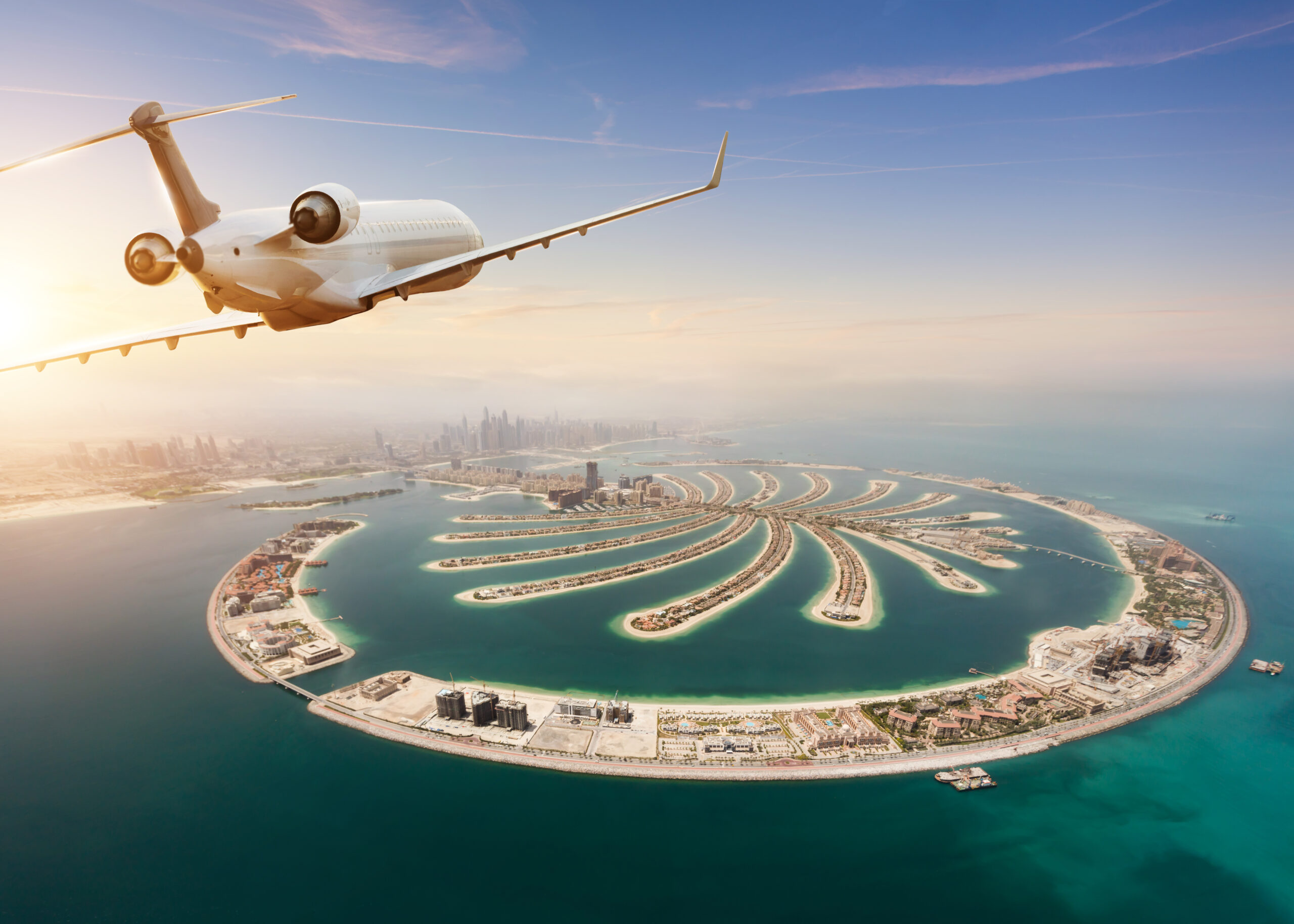 Private jet plane flying above Dubai city